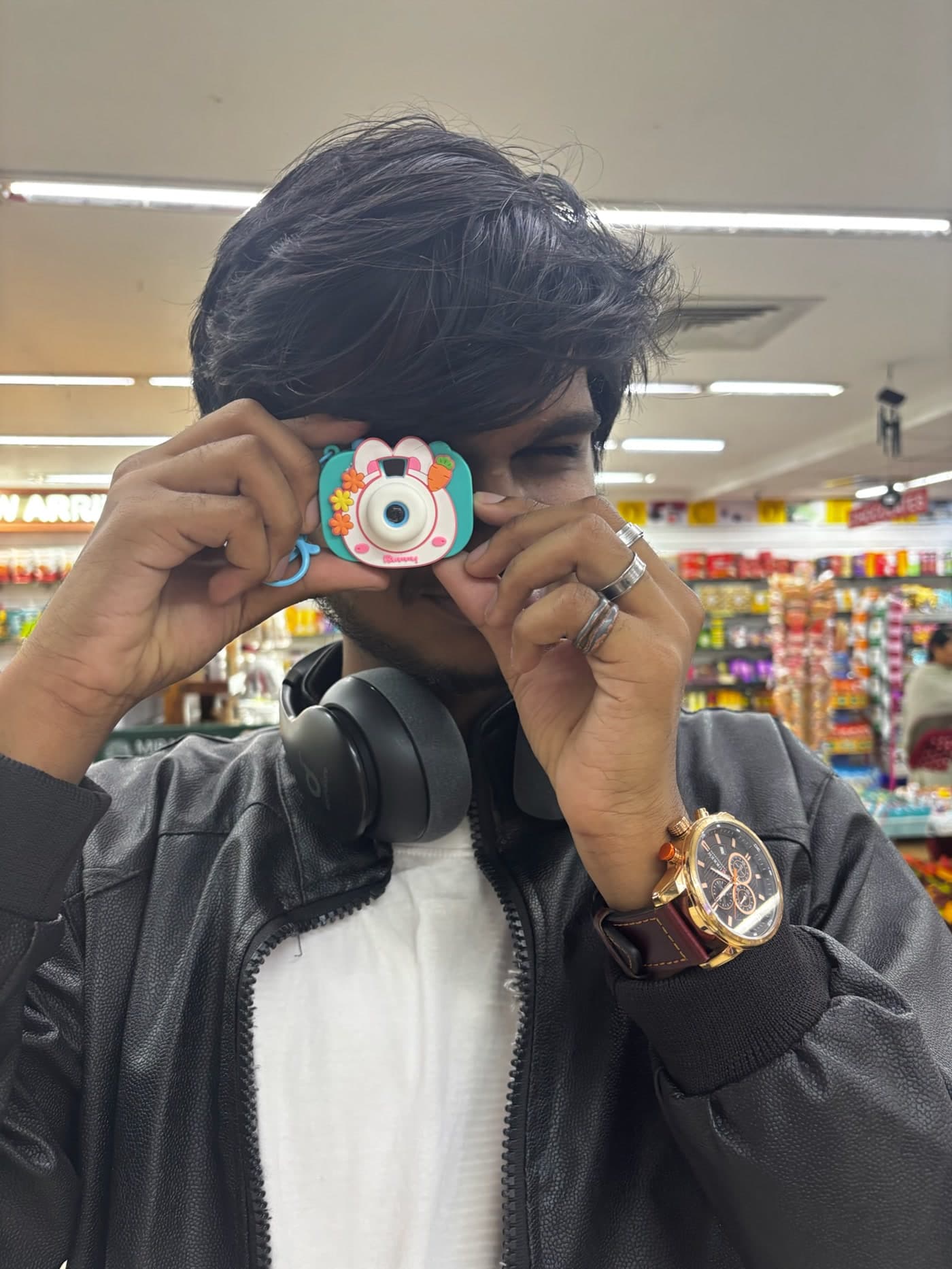 Sri looking through a tiny toy camera